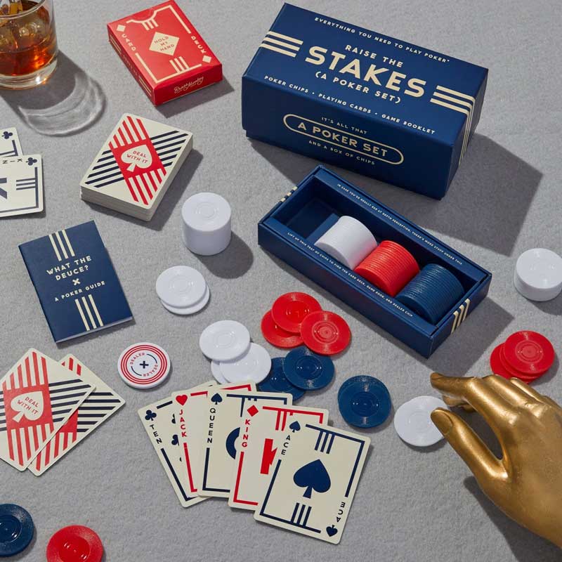 Poker game set with chips, a deck of cards and an instruction book