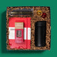 Elegant holiday gift box with a notebook, pen set, slide top travel mug and more