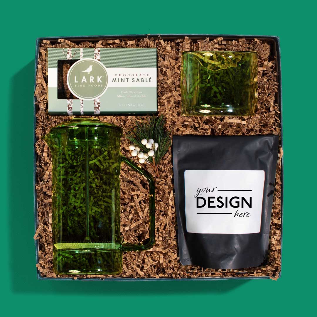 Festive holiday gift box with coffee beans, a French Press, mug and chocolate