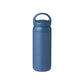 Insulated, stainless steel travel tumbler with a rounded handle for easy carrying