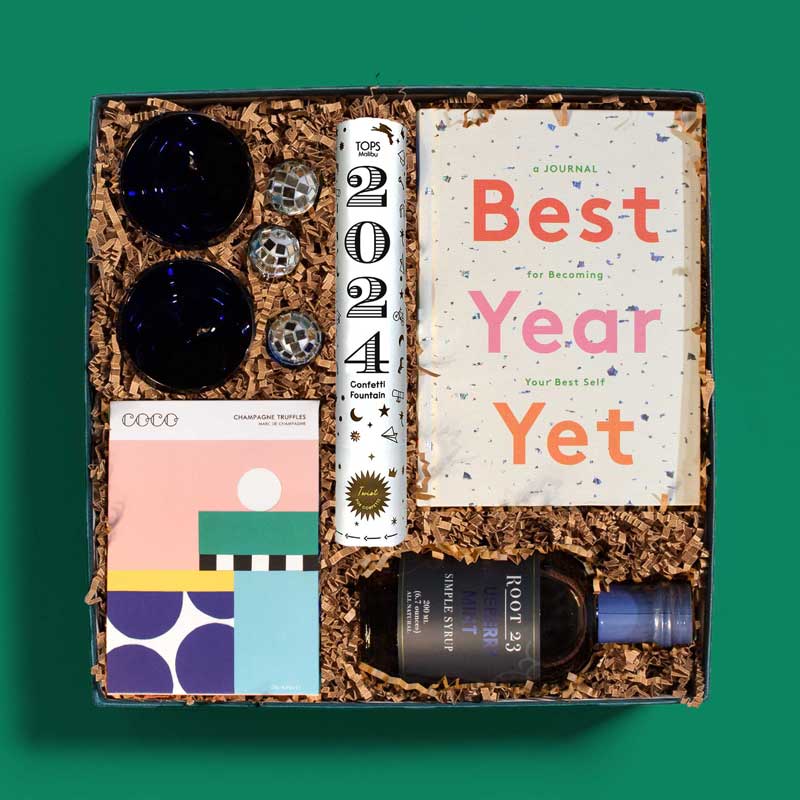 New Year’s gift box with confetti, chocolate, an inspirational book and more