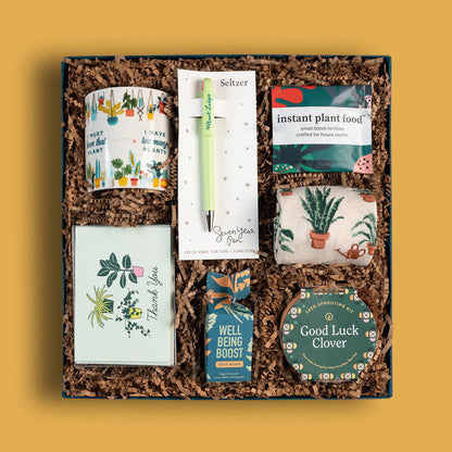 Plant-themed corporate gift box with mug, plant seeds, an indoor grow kit and more. 