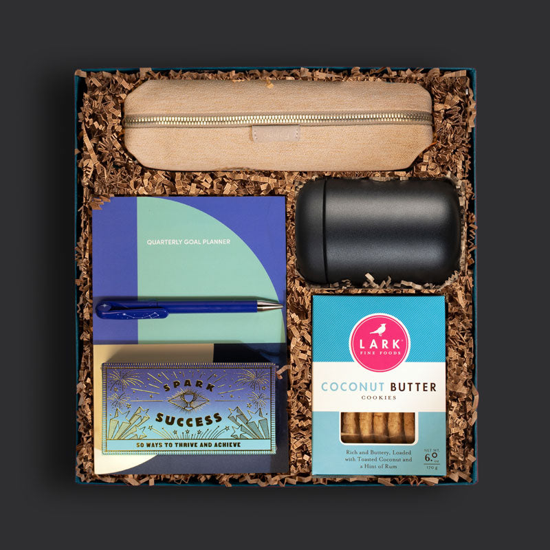 Onboarding gift box for new hires with a goal planner, travel mug, pencil case and more