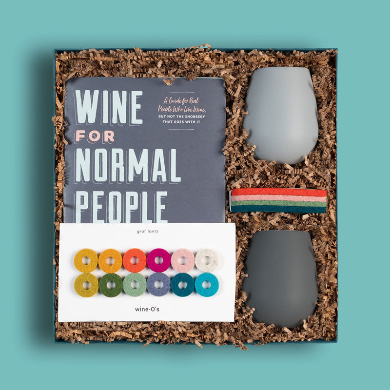 Brightlane curated gift box with a book, wine glasses, coasters and other things for wine lovers
